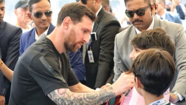 Lionel Messi signs a young fan’s T-shirt in Kolkata. (Partha Paul)