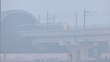 A Metro train passes through the dense smog, at Akshardham in New Delhi on Wednesday. (Photo/ANI)