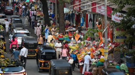 A view of the market area outside Vile Parle station, where hawkers have encroached portions of the footpath as well as the road. (Express photo by Sankhadeep Banerjee)
