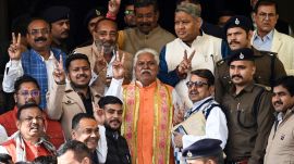 Newly elected Speaker of Bihar Assembly Prem Kumar and other MLAs show victory sign as they arrive at the Bihar legislative assembly to attend the Winter Session. (ANI Photo)