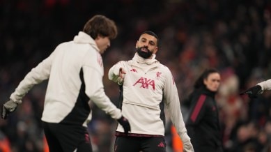 Liverpool's Mohamed Salah, centre, warms up before the English Premier League match against Sunderland. (PHOTO: AP)