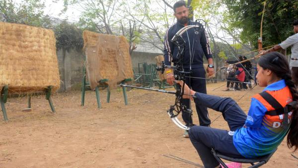 Sheetal Devi training at Punjabi University grounds at Patiala along with coach Gaurav Sharma and other trainees. (Express Photo by Harmeet Sodhi)