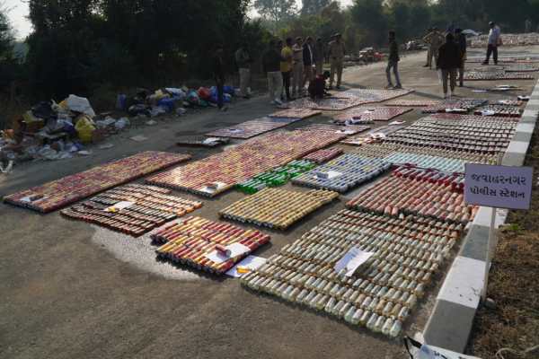 On Monday morning, liquor seized by 17 police stations in Vadodara city was laid out on a deserted road leading to Koyali on the city’s outskirts,