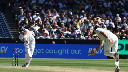 England's Jamie Smith, left, is bowled by Australia's Scott Boland, right, during their Ashes cricket Test match at MCG on December 26. (AP Photo)