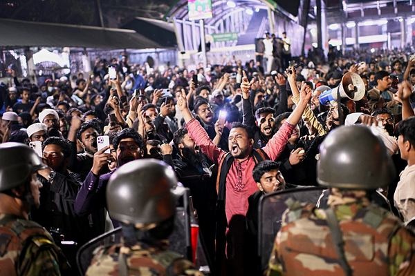 Protesters shout slogans in front of the premises of the Prothom Alo daily newspaper in Dhaka, Bangladesh.