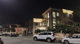 Rajput showing the stretch of road that he went to court against; and the BJP office and the road leading to it. Express photos by Jasbir Malhi