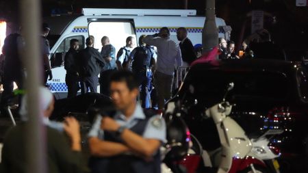 Police set up as they investigate at Bondi Beach after a reported shooting in Sydney, Sunday, Dec. 14, 2025. (AP Photo/Mark Baker)