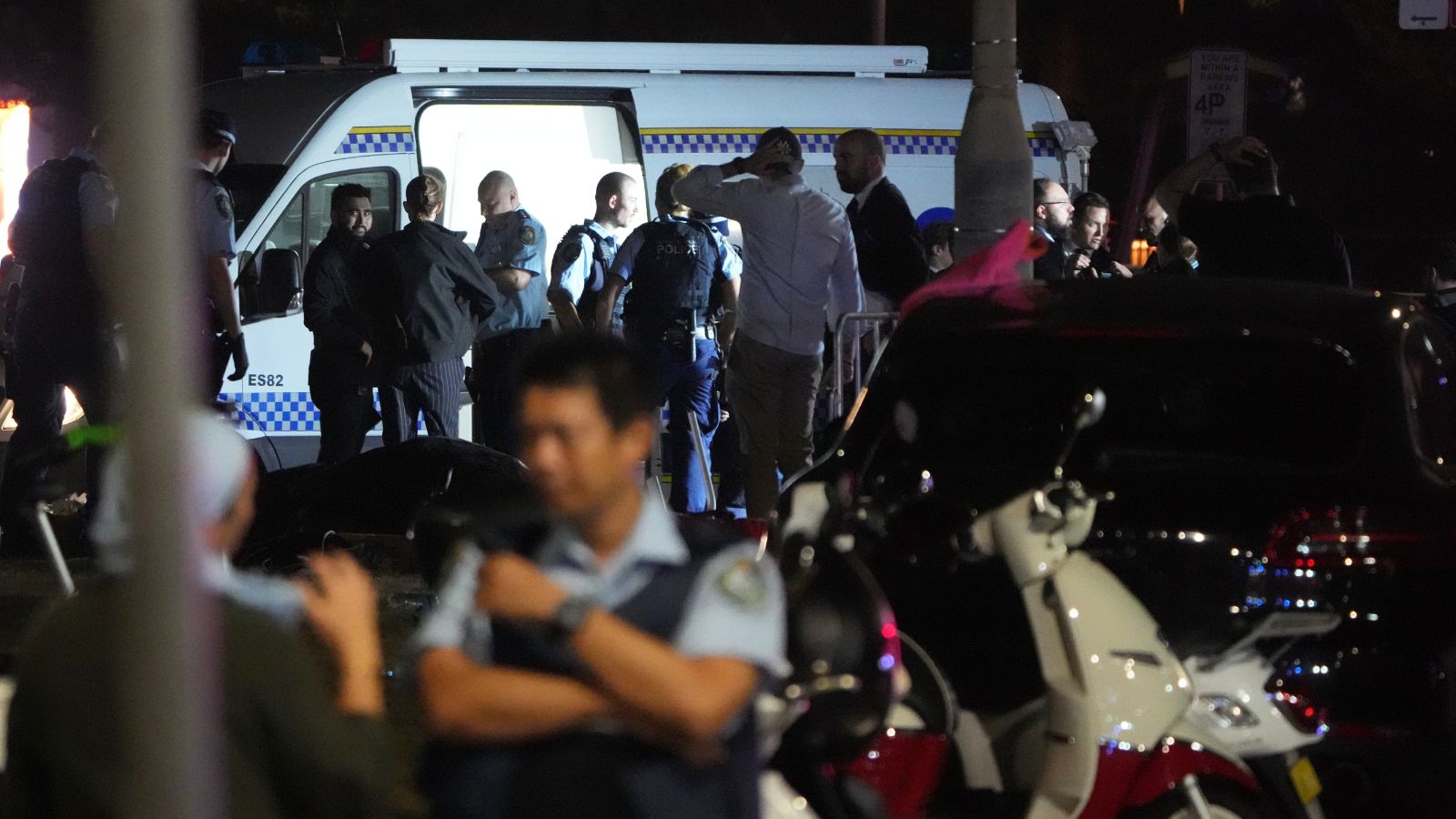 Police set up as they investigate at Bondi Beach after a reported shooting in Sydney, Sunday, Dec. 14, 2025. (AP Photo/Mark Baker)
