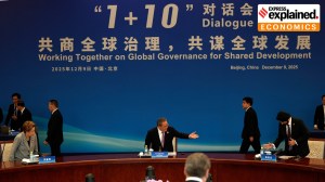 Chinese Premier Li Qiang, center, invites other attendees, including World Bank President Ajay Banga, during the 1+10 Dialogue with heads of major international economic organizations in Beijing, China, Tuesday, Dec. 9, 2025.
