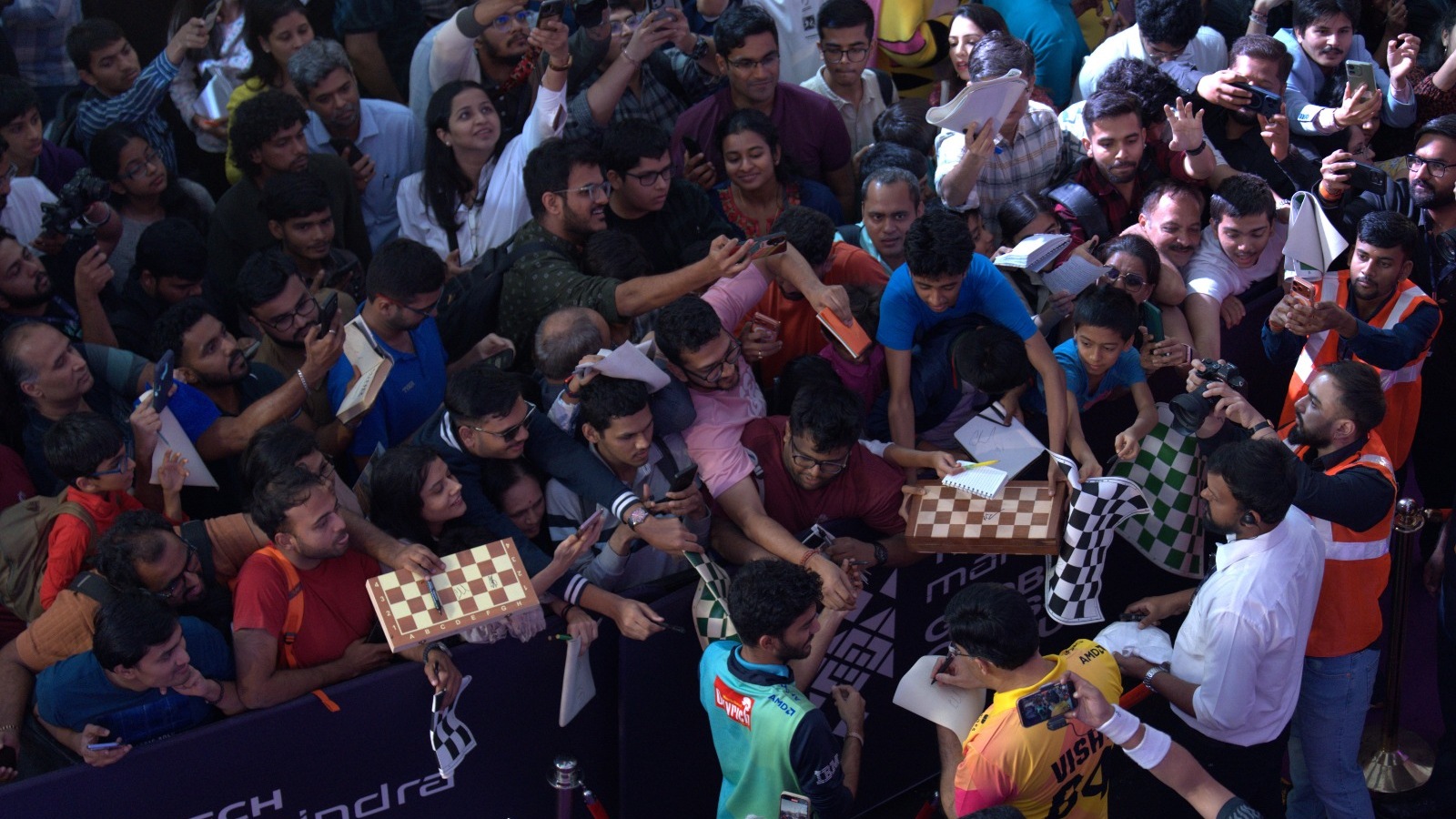 World champion Gukesh Dommaraju and chess legend Viswanathan Anand sign autographs together after their match in the Global Chess League. (Photo: GCL)