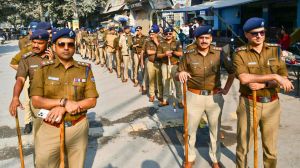 Nainital, Dec 01 (ANI): Police personnel take out a flag march over Supreme Court's verdict in the Banbhulpura railway land encroachment case of Haldwani, in Nainital on Monday. (ANI Photo)