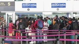 Passengers wait at the airport as IndiGo’s flight disruptions continue