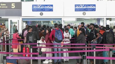 Passengers wait at the airport as IndiGo’s flight disruptions continue