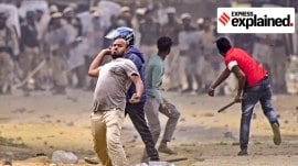 People throw stones during a clash between two groups over the issue of eviction, at Kheroni in West Karbi Anglong district, Assam, Tuesday, Dec. 23, 2025.