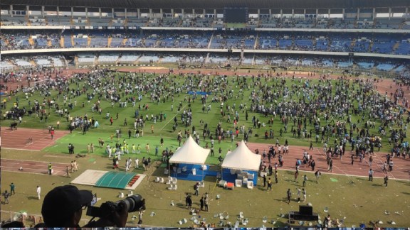 Fans storm the Salt Lake Stadium after Lionel Messi's fleeting appearance on Saturday. (Express Photo by Sayak Dutta)