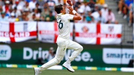 Australia's Mitchell Starc bowls a delivery on day two of the first Ashes cricket test match between Australia and England in Perth, Saturday, Nov. 22, 2025. (AP Photo)