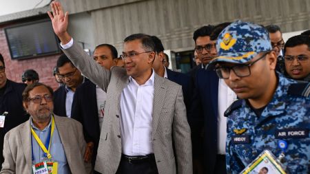 Bangladesh Nationalist Party (BNP) Acting Chairman, Tarique Rahman, waves to supporters at Hazrat Shahjalal International Airport in Dhaka after returning from London, ending more than 17 years of self-imposed exile, Thursday, Dec. 25, 2025. AP/PTI