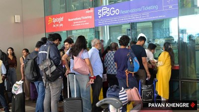 Passengers outside the IndiGo flight ticket counter at Pune International Airport.