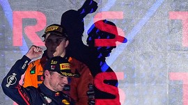 Red Bull driver Max Verstappen celebrates in front of second-placed McLaren driver Oscar Piastri after winning the Qatar Grand Prix, in Lusail.(AP Photo)