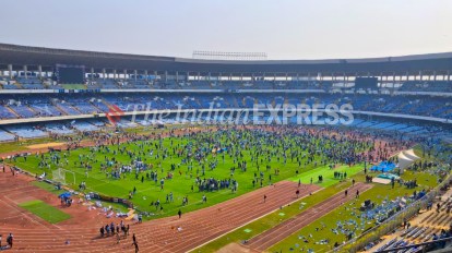 Angry fans in Kolkata invade the pitch at Salt Lake Stadium after Lionel Messi left after a brief appearance during the GOAT Tour. (Express Photo by Partha Paul)
