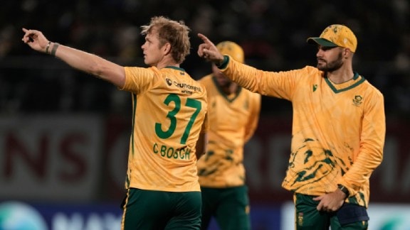 South Africa's captain Aiden Markram, right, and Corbin Bosch, left, set the field during the third T20 cricket match between India and South Africa in Dharamshala, India, Sunday, Dec. 14, 2025. (AP Photo)