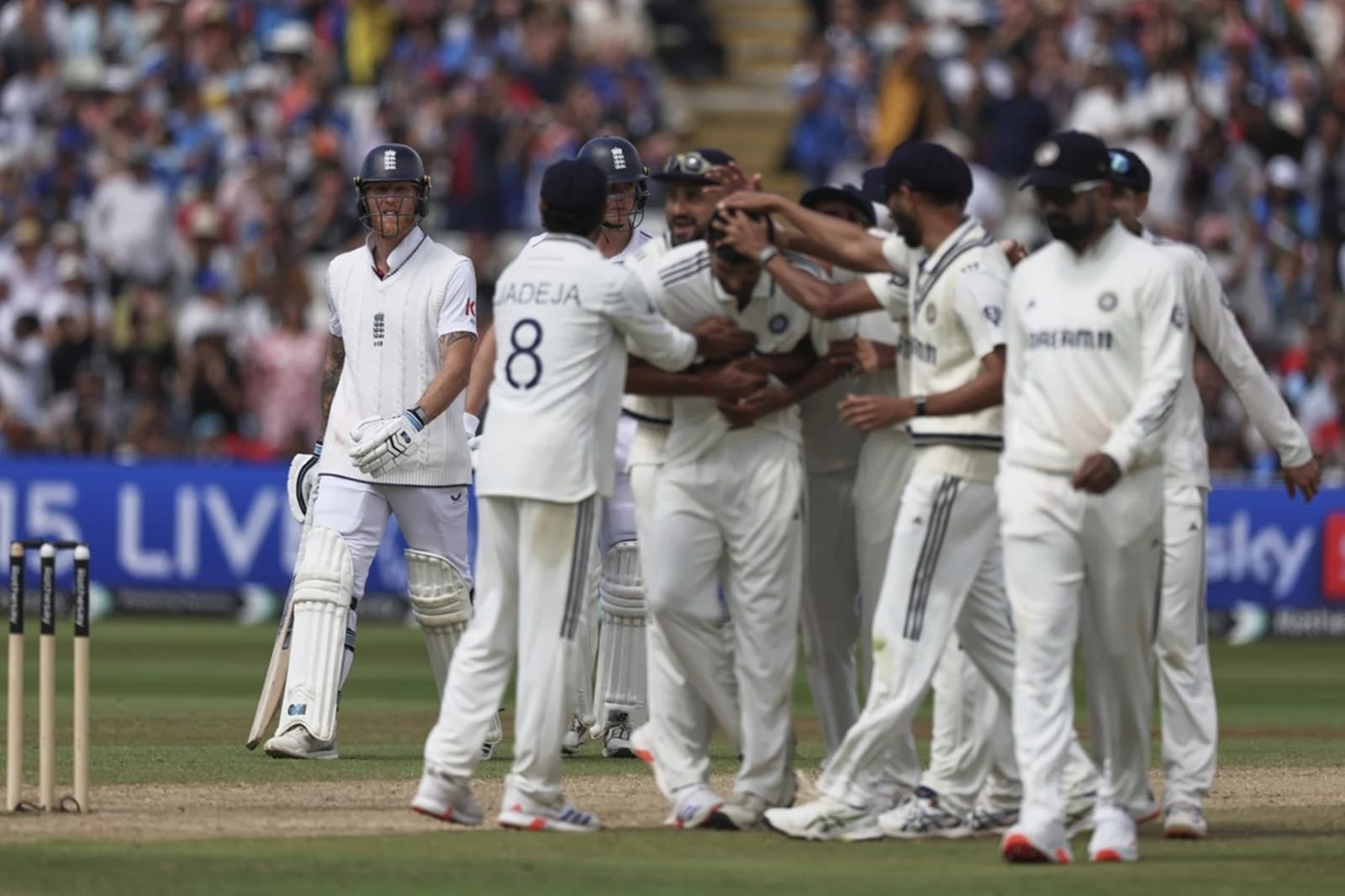 Ben Stokes walks back after falling to Washington Sundar as India celebrate. (AP Photo)