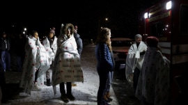 Two students were killed, several injured, and the suspect remains at large as the campus reels from shock.