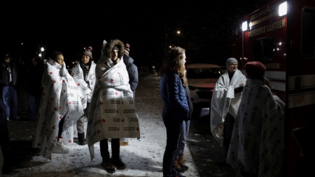 Two students were killed, several injured, and the suspect remains at large as the campus reels from shock.