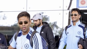 Indias captain Suryakumar Yadav, left, and Abhishek Sharma arrive at Kangra Airport ahead of the third T20 international cricket match between India and South Africa. (PTI Photo)