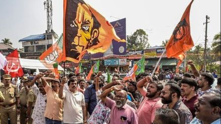 BJP workers celebrate their victory during the Kerala local body polls, at a counting station in Thiruvananthapuram