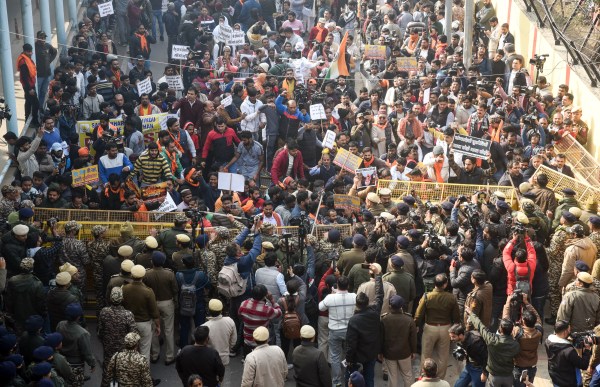 New Delhi, Dec 23 (ANI): Protestors try to break barricades during a protest by Vishva Hindu Parishad and Bajrang Dal over the atrocities against Hindus and the mob lynching of Dipu Chandra Das in Bangladesh, near the Bangladesh High Commission, in New Delhi on Tuesday (ANI Photo/Sumit)
