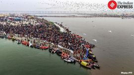 Police personnel and volunteers are deployed along the Sangam ghats to manage pilgrim movement on the opening day of Magh Mela