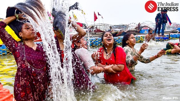 Devotees take a holy dip at the Triveni Sangam in Prayagraj on the occasion of Paush Purnima