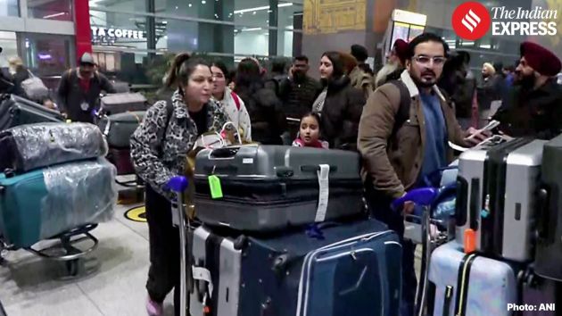 Families of Indian pilgrims, workers and students waited inside the arrivals area, sitting on cold metal benches