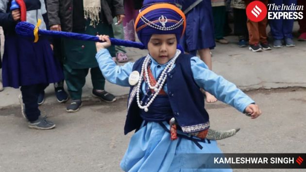 Children and families gather along the route, participating in the festive atmosphere of the Nagar Kirtan