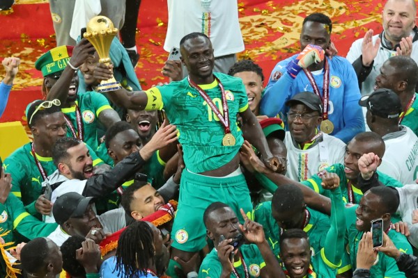 Senegal's Sadio Mane holds the trophy aloft as he celebrates with teammates after winning the Africa Cup of Nations final soccer match between Senegal and Morocco in Rabat, Morocco, Sunday, Jan. 18, 2026. (AP Photo)