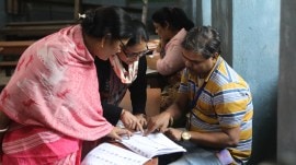 BLOs sits with voters after a draft electoral roll was published