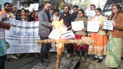 Members of the Vishwa Hindu Mahasangh burn an effigy of Bangladesh Chief Adviser Muhammad Yunus, in front of the Bangladesh Assistant High Commission office in Guwahati. (ANI Photo)