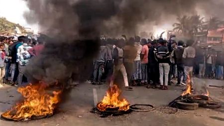 Tyres being burnt during violence in Beldanga
