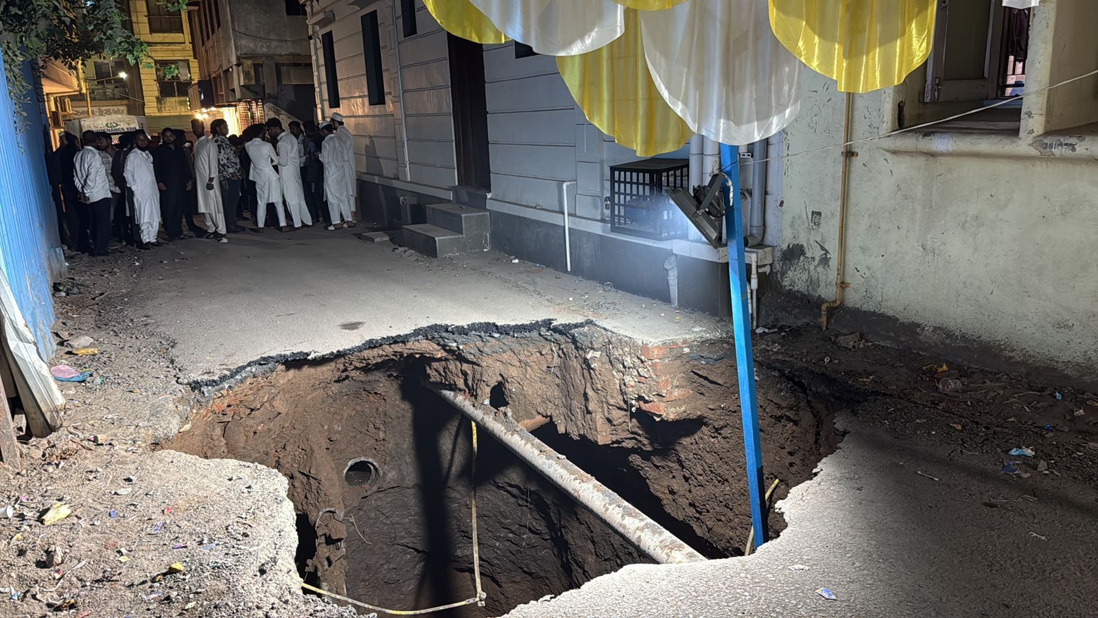 Road cave-in creates 20-foot-deep crater during wedding dinner in Surat, triggering panic among guests