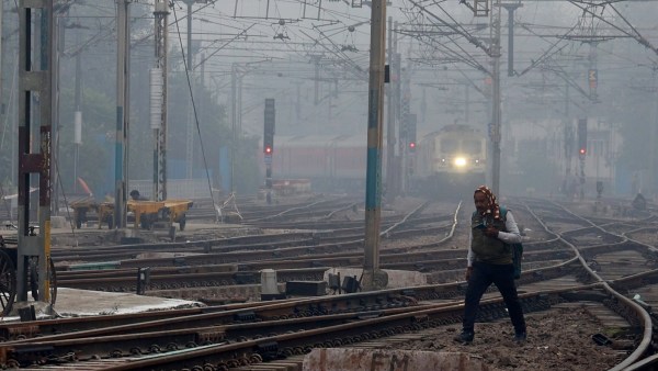 Passengers at the New Delhi Railway Station on Wednesday, December 31, on a day when several trains were delayed due to fog.
