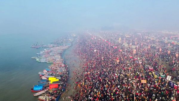 Devotees gather in large numbers at the Magh Mela Kshetra to take a holy dip at Sangam, on the occasion of Mauni Amavasya, in Prayagraj on Sunday. (ANI Photo)