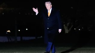 President Donald Trump waves as he walks from Marine One to the White House, Sunday, Jan. 4, 2026, in Washington. (AP Photo)