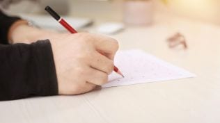 student writing paper