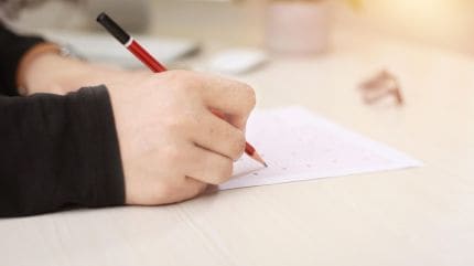 student writing paper