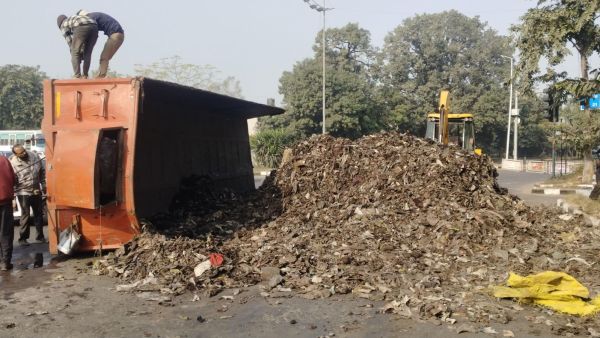 Garbage spilled on a road after a trailer overturned near the roundabout of sector 20-34 of Chandigarh on Sunday. Jasbir Malhi