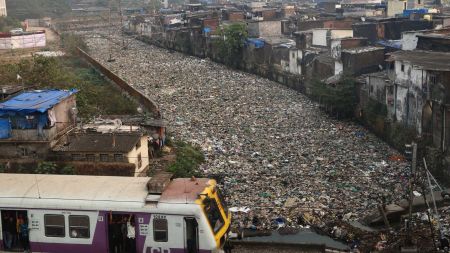A distressing scene of pollution in Mankhurd, Mumbai, where a waterbody between Lallubhai Compound and Sonapur is choked with floating waste. (Express Photo by Amit Chakravarty)