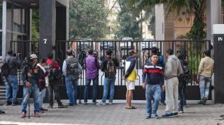Media personnel outside the residence of Pratik Jain. (PTI Photo)