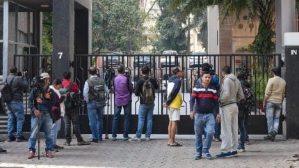 Media personnel outside the residence of Pratik Jain. (PTI Photo)