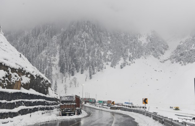 A truck wades through the snow-covered area in the Kashmir Valley at Sonamarg in Ganderbal on Friday, following snowfall in higher reaches as minimum temperatures dipped. (ANI Photo)